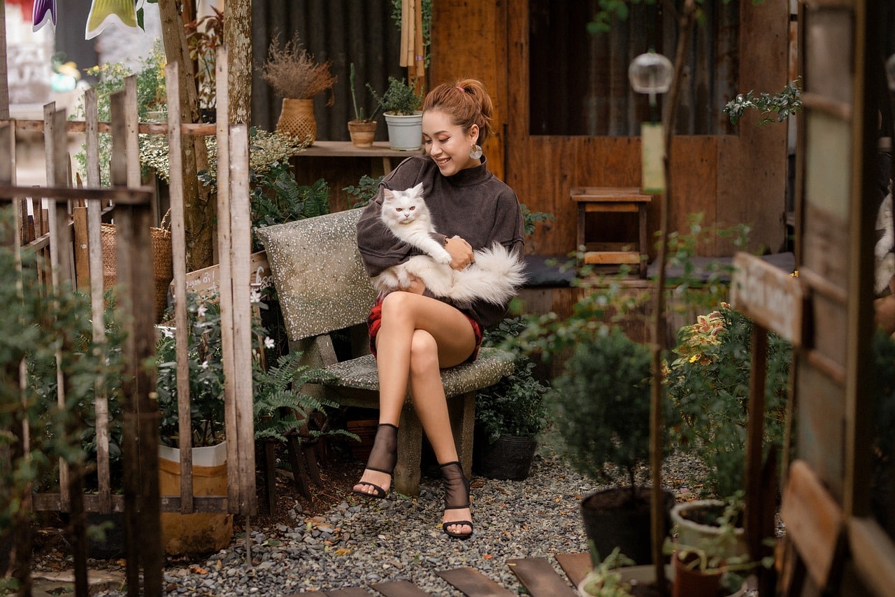 Jane holding her cat - she needs to get an international health certificate to relocate her cat to Singapore